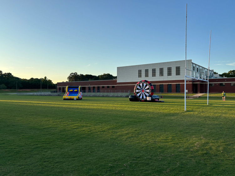 Soccer Dart inflatable game set up on a school football field, Milner, GA area